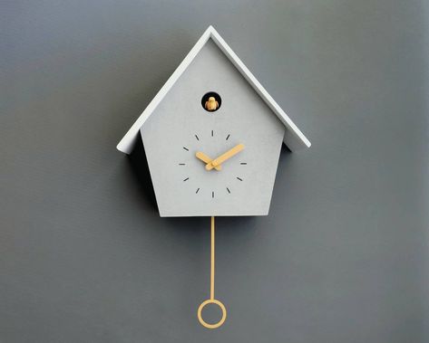 "Each cuckoo clock is hand crafted. The box is made of concrete coated wooden birch plywood and MDF wood. Painted and varnished with water-based painting and varnish. Clock hands and the pendulum are made of recyclable plastic. Cuckoo bird comes out, chirps, flap wings and make the cuckoo sound every hour than goes back inside (The bird is out in the pictures). Cuckoo count changes regarding time. (For example when it is 11 AM the cuckoo sound counts 11 times) The pendulum swings. The clock is s Modern Cuckoo Wall Clock, Cookoo Clocks, Modern Cuckoo Clocks, Clock Sound, Picture Jokes, Cuckoo Clocks, Black Clocks, Yellow Accessories, Pendulum Clock