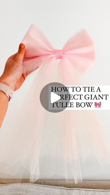 How To Make Tulle Bows For Wedding, How To Tie A Tulle Bow, Gift Baskets Wrapped In Tulle, Pink Tulle Bow, Making A Bow With Tulle, Crafts With Tulle Diy, Diy Tulle Hair Bow, How To Tie Tulle Bows, Projects With Tulle