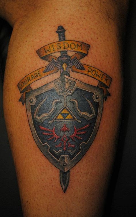 Zelda tattoo! Best hyrulian shield I've seen done. … I like this more than the traditional zelda tattoos ive seen done Shield Tattoo, Video Game Tattoos, Hylian Shield, Nerdy Tattoos, Zelda Tattoo, Nerd Tattoo, Geek Tattoo, Gaming Tattoo, Great Tattoos