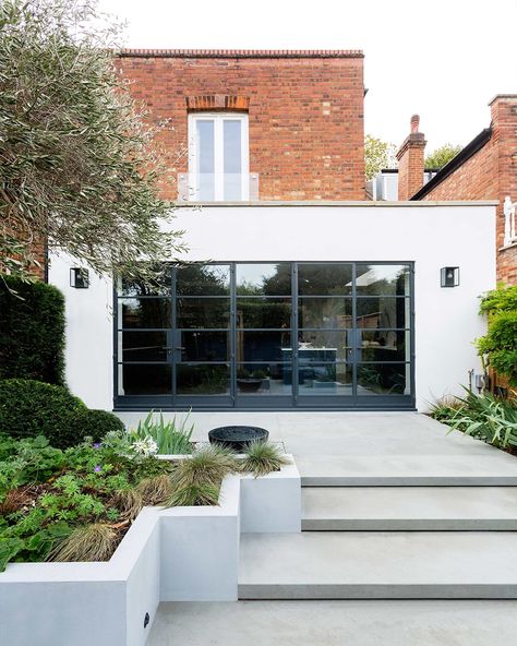 Our design team reconfigured the ground floor and added a small rear and side extension to open the space for a huge kitchen and dining area, with a bank of Crittall windows leading to the garden #interiors #architecture #construction https://zulufish.co.uk/projects/abinger-road/ Rear Extension Ideas, Crittall Windows, Chiswick London, Crittal Windows, Kitchen And Dining Area, Side Extension, Huge Kitchen, House Extension Design, Rear Extension