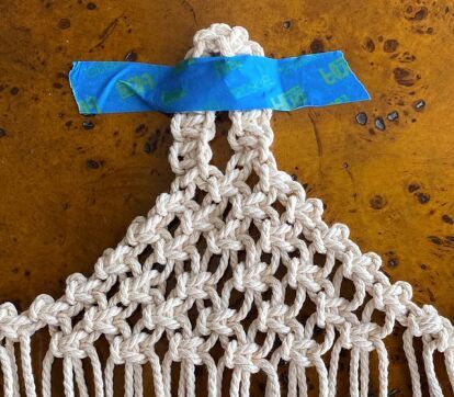 Making this little macramé hanging pod is a bit trickier than a simple wall hanging, but it is well worth the effort. I already have a ton of ideas in mind for these little baskets. They would look adorable used for storage on a nursery wall. I also plan on making some for my son’s upcoming wedding in an actual old barn; how sweet would these look hanging on rustic wooden columns? So take a little time, learn this technique, and you’ll find a myriad of uses for your macramé hanging pod… Hanging Basket Macrame, Macrame Wall Pocket Diy, Macrame Wall Pocket, Diy Outdoor Candles, Simple Wall Hanging, Macrame Basket, Wooden Columns, Colorful Wall Hanging, Yarn Wall Art