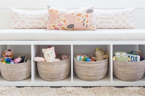 Alyssa Rosenheck - Amanda Barnes Interior Design - Ethereal girl's nursery features a white freestanding storage bench filled with gray woven baskets and lined with pink trellis pillows placed under a window. Kallax Bookshelf, Bookshelf Bench, Amanda Barnes, Nursery Details, Window Seating, Diy Playroom, Freestanding Storage, Ikea Kallax, Playroom Design