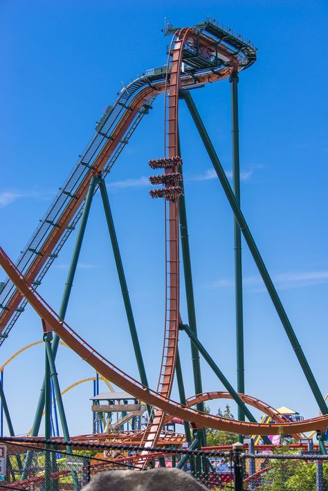 Canada's Wonderland introduced the world's longest, tallest and fastest dive roller coaster - Yukon Striker! Hang over a 90-degree drop for three breathtaking seconds, staring 245 feet down into an underwater tunnel. Then suddenly you dive, reaching speeds of 130 km/h and soaring through four dynamic inversions, including a complete 360-degree loop – the only one of its kind for a dive coaster. Canada Wonderland, Alton Towers Rides, Underwater Tunnel, Joyland Amusement Park, Roller Coaster Theme, Winter Wonderland London, Canada's Wonderland, Black Weaves, Canadas Wonderland