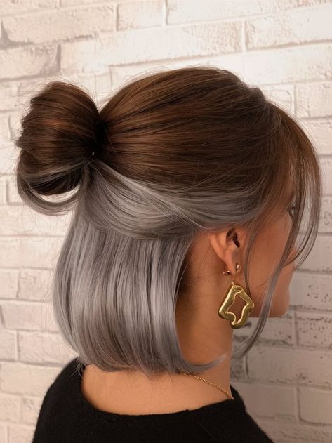 Achieve a modern and sophisticated look this autumn with a half-up fall haircut featuring striking silver accents. The sleek top knot contrasts with the layered bob, creating a unique and stylish hairstyle that’s perfect for the season. This haircut is ideal for those looking to embrace contemporary trends while adding a touch of elegance to their autumn style. Short And Curly Hair, Peekaboo Blonde, Peekaboo Braids, Fall Haircut, Peekaboo Hair Colors, 2025 Trends, Peekaboo Color, Peekaboo Highlights, Blonde Pink