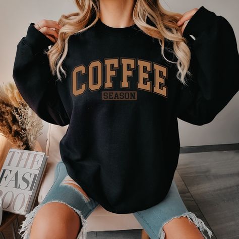 Indulge your passion for the rich aroma and comforting warmth of coffee with our exclusive Coffee Crewneck Sweatshirt. Embrace the cozy vibes of winter in style with this must-have coffee lover sweatshirt, meticulously designed for ultimate comfort and warmth. Crafted from premium materials, this coffee sweater is perfect for the chilly season, making it the ideal winter crewneck sweatshirt for any coffee aficionado. Whether you're a dedicated coffee drinker or simply enjoy the occasional cup, this coffee sweatshirt is a fashionable expression of your love for the beloved beverage. Elevate your winter wardrobe with this statement piece that seamlessly blends comfort and style, ensuring you stay snug while flaunting your passion for coffee. Upgrade your seasonal attire with our Coffee Crewn Coffee Shop Shirt Ideas, Crew Neck Sweatshirt Outfit, Crewnecks For Women, Coffee Crewneck, Fall Style Casual, Winter Crewneck, Coffee Sweater, Coffee Drinker, Diy Sweatshirt