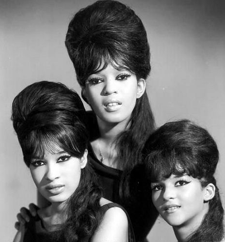 The Ronettes    		The Ronettes were a girl group of the 1960s from New York City, best known for their work with producer Phil Spector. They consisted of lead singer Veronica Bennett (a.k.a. Ronnie Spector), her sister Estelle Bennett, and their cousin Nedra Talley. Their defining album is Presenting the Fabulous Ronettes Featuring Veronica from 1963, and their most famous songs include "Be My Baby", "Baby, I Love You", "(The Best Part of) Breakin' Up", and "(Walking) in the Rain". Ronnie Spector, The Ronettes, 1960s Hair, Beehive Hair, Romeo Santos, Three Women, Pochette Album, Walking In The Rain, Funky Hairstyles