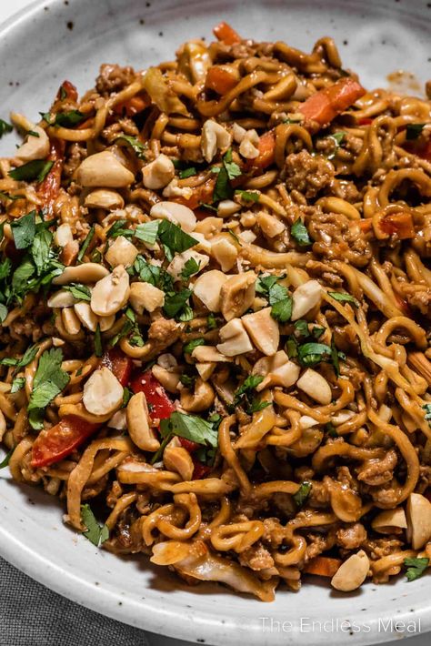 These saucy Thai peanut chicken noodles are a quick and delicious weeknight meal. They're loaded with ground chicken, ramen noodles, and vegetables then smothered in a creamy homemade peanut sauce. They're healthier than takeout, and they're ready in just 25 minutes! #theendlessmeal #peanutnoodles #thainoodles #noodles #chickennoodles #thaichicken #pasta #dinner #easydinner #thai Ground Chicken Ramen, Ramen Noodle Sauce, Chicken Peanut Noodles, Thai Chicken Peanut, Peanut Chicken Noodles, Chicken Ramen Noodle Recipes, Thai Chicken Noodles, Thai Peanut Noodles, Thai Peanut Chicken