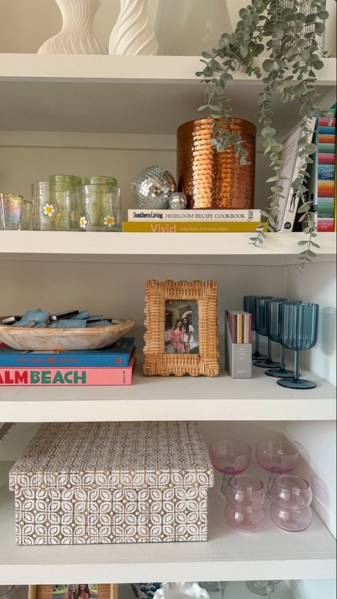 Cookbooks On Top Of Fridge, Minimalist Apartment With Pop Of Color, New Grad Apartment, College Home Aesthetic, Fun Shelf Decor, Girly Shelf Decor, Floating Shelf Aesthetic, Lauren Loveless Apartment, Newlywed Apartment Decor