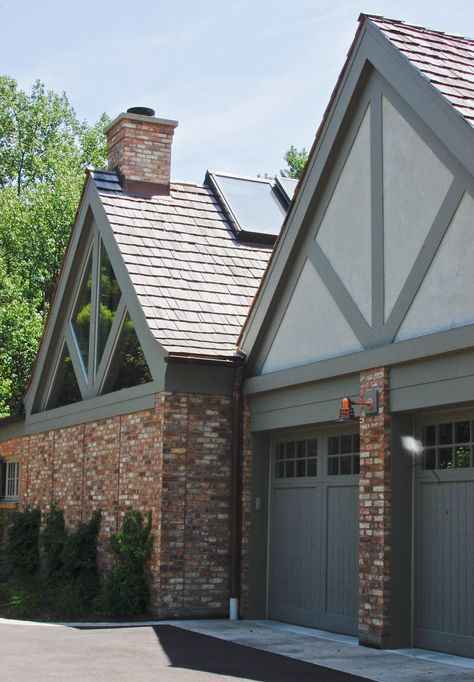 Addition/renovation of 1930's tudor home. Family room, exercise room, "spa" room & 2 car garage. Chicago common brick, painted cedar, stucco & wood shake roof to match original house. North elevation drive-way & side entry to addition/renovation. Modern Tudor Exterior Paint Colors, Tudor Garage, Tudor Exterior Paint, Tudor Exterior, Exterior Paint Colours, Brick Paint Colors, Tudor House Exterior, Tudor Homes, Garage Designs