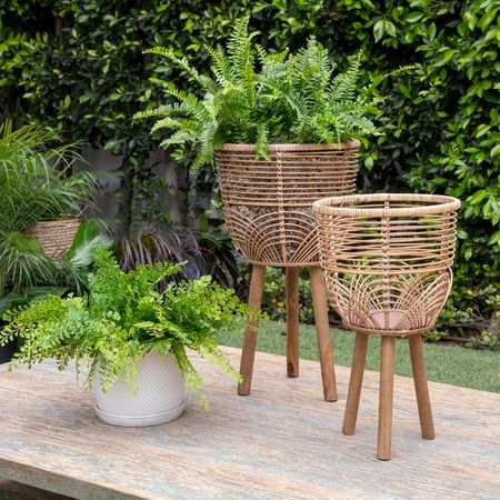 Sagebrook Home S/2 Wicker Planters 10/12", Natural Round Brown Bamboo Wood 22"H Weave Contemporary. Level up your plant game with this set of 2 wooden planters. These natural brown planters sit on long, narrow stands and come in two different sizes. The pair - crafted out of bamboo and rattan - can be creatively placed together or spread around for a distinct look. Create a plant oasis in any indoor or outdoor space! Improve the air quality indoors while sprucing up your style or display your fa Boho Front Porch, Wicker Planter, Indoor Outdoor Planter, Basket Planters, Rustic Contemporary, Wood Planters, Deck Decorating, Outdoor Planters, Store Decor