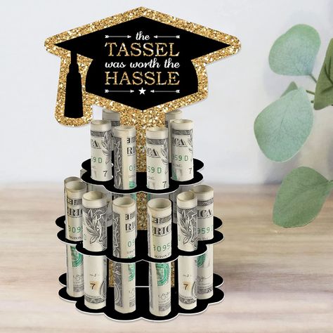 Make every graduation celebration extra special with our Tassel Worth the Hassle - Gold Cash Cake! This unique money cake includes a DIY kit that can hold up to 20 rolled bills. The gold and black design features a grad cap-shaped centerpiece and three layers of varying sizes. Surprise your recipient with a trendy and creative way to gift money. Assembly is easy and the high-quality materials ensure a memorable keepsake. Cash Cake, Diy Grad Cap, Diy Graduation Party, Grad Diy, Graduation Money Gifts, Easy Punch, Diy Graduation Gifts, Gold Graduation Party, Graduation Party Diy