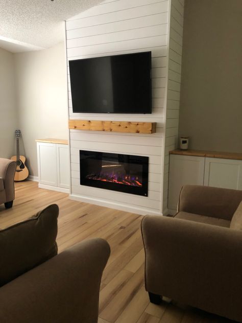 Vaulted ceiling entertainment center with shiplap, fireplace. Floating mantel. Cabinet on each side. Vaulted Ceiling Shiplap, Ceiling Shiplap, Diy Fireplace Mantle, Built In Around Fireplace, Fireplaces Layout, Electric Fireplace Wall, Vaulted Ceiling Living Room, Built In Electric Fireplace, Floating Mantel