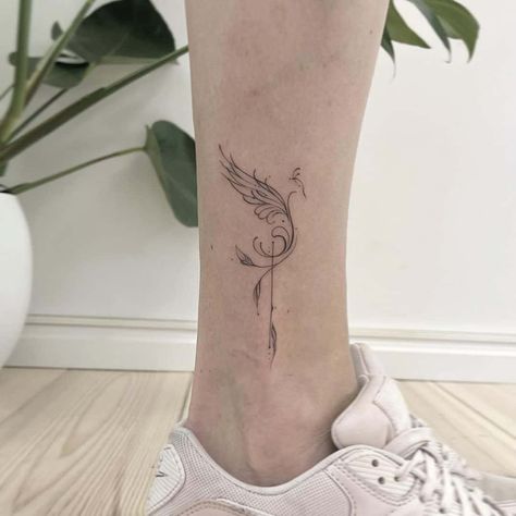 Fine Line Bird tattoo on foot #birdtattoodesign Pheonix Tattoo On Ankle, Small Tattoo For Ankle, Tattoo Design For Legs Women, Phoenix Tattoo Ankle For Women, Phoenix Foot Tattoo, Phoenix Leg Tattoo For Women, Phoenix Tattoo Ankle, Fenix Bird Tattoo, Tattoo Foot Woman