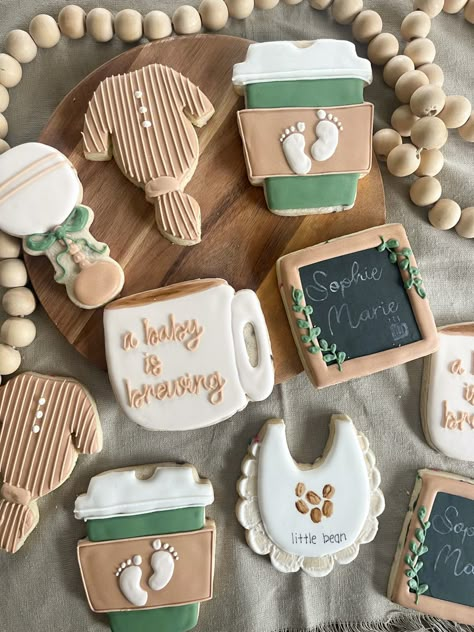 Gender Reveal Coffee Theme, Coffee Themed Party Favors, Coffee Baby Shower Cookies, Bean Baby Shower Ideas, Baby Brewing Coffee Shower Ideas, Coffee Shop Baby Shower Ideas, Baby Shower Coffee Theme, A Baby Is Brewing Cookies, Coffee Baby Shower Theme