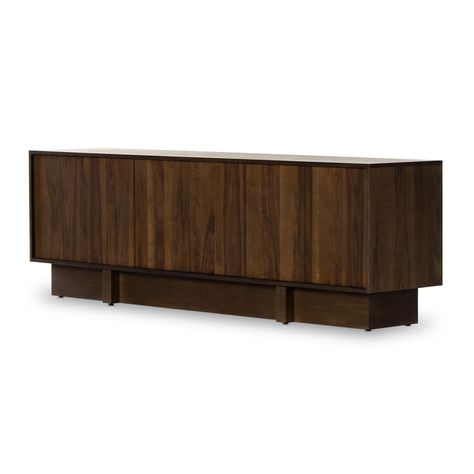 A dark finish brings depth to a simply shaped sideboard of rich walnut and mahogany veneer. A structured plinth-style base supports a spacious interior made from mixed wood veneers. Rear cutouts for cord management.Product Overview Color: Black Mdf Dimensions: 94"W x 20"D x 30"H Material: Engineered Hardwood, Mahogany Modern Buffets And Sideboards, Sideboard Styles, Four Hands Furniture, Modern Entertainment Center, Modern Buffet, Buffets And Sideboards, Cabinet Shelving, Cord Management, Wooden Design