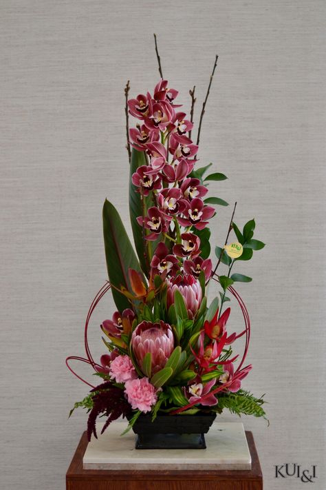 Cymbidium Arrangement, Protea Arrangements Modern, Cymbidium Orchids Arrangement, Protea Flower Arrangements, Tropical Wedding Centerpieces, Basket Flower Arrangements, Orchid Flower Arrangements, Hotel Flowers, Tropical Flower Arrangements