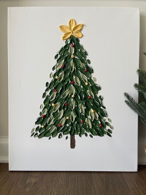 "This textured Christmas Tree painting is sure to add beauty to your holiday home decor!  Beautiful snowy Christmas Tree on a white background. Comes unframed.   Made with a mix of high quality acrylic paints and acrylic mediums for a beautiful 3D effect. Handmade with palette knives.  16x20 inch gallery wrapped canvas and coated with UV resistant varnish for protection.  Each piece is unique and cannot be replicated, making this truly a \"one of a kind\" painting. *IMPORTANT: Colors and lighting may vary slightly in photographs. Colors and lighting of the original piece may also vary slightly depending on the natural lighting in the room.* ~Each artwork piece is carefully and thoughtfully prepped, wrapped, stored to ensure its safety upon delivery" Christmas Tree Ideas Painting, Ornament Painting On Canvas, Christmas Tree Canvas Painting Easy, Simple Christmas Canvas, Simple Christmas Tree Painting, Christmas Textured Art, Baby Christmas Art, Aesthetic Christmas Painting, Easy Christmas Tree Painting