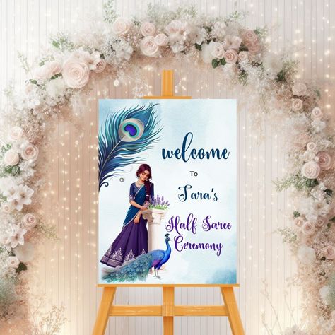 Announcing our new half saree ceremony welcome sign template in peacock theme! 🎉✨ Infuse your event with the richness of tradition and the beauty of these vibrant hues. Customize this stunning design to welcome your guests with grace and style. Download now and let the enchantment begin! #halfsareeceremony #halfsareeceremonywelcomesign #pubertywelcomesign #pubertyceremony #pubertysign #halfsareeceremonysign Click link in bio to shop this design. Half Saree Ceremony, Ceremony Welcome Sign, Saree Ceremony, Saree Function, Half Saree Function, Welcome Board, Peacock Theme, Joyous Celebration, Ceremony Signs