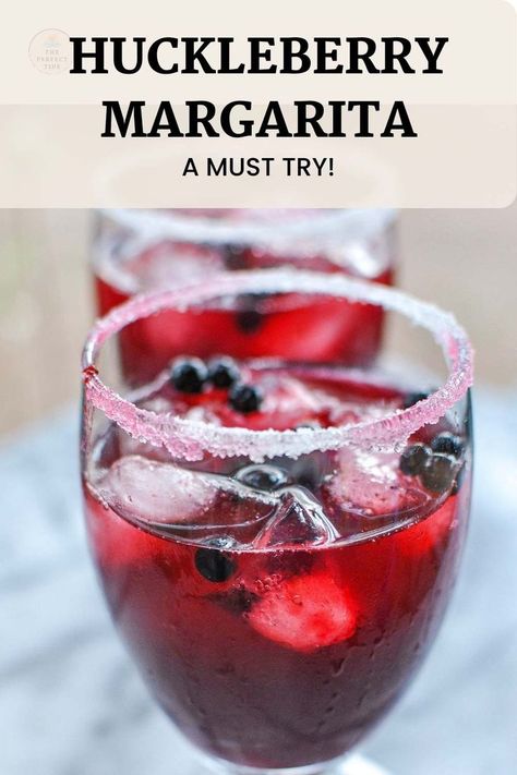 bright red drink on the rocks with fresh huckleberries and a sugar rim Huckleberry Vodka Recipes, Fresh Huckleberry Recipes, Huckleberry Lemonade Recipe, Huckleberry Syrup Recipe, Huckleberry Margarita, Margarita Recipes On The Rocks, Recipes Date Night, Date Night Dinner Recipes, Lime Simple Syrup