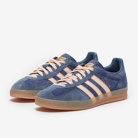 The 90s return in signature style with the adidas Originals Gazelle Indoor in Dark BlueBliss OrangePreloved Ink, an indoor revisit of the 1991 design that shows off in smooth leather. The adidas Originals Gazelle Indoor is a onetoone reissue of the original 1991 Gazelle design, made for comfort indoors with a translucent gum sole that wraps the shoe just like the indoor training OG. Gazelle lettering on the side adds that true authentic touch, on an upper that carries familiar textures, material Blue Adidas Gazelle, Adidas Gazelle Blue, Adidas Gazelle Shoes, 90s Sneakers, Kids Football Shirts, Kids Football Boots, Gazelle Adidas, Adidas Gazelle Indoor, Iconic Shoes