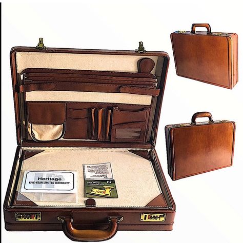 Product Description: Heritage (Vintage) High Quality Leather, Executive Briefcase (Nwot) Suggested Retail Price $599.99 Dept: 5 Product Type: Briefcase/Luggage/Totes/Bags Designer: Heritage Style: Executive Briefcase Material: High Quality Leather Hardware: Gold-Tone Strap Material: N/A Accents: Front Change Combination Locks Charmed: N/A Pockets: Multi/File Folders/Pen Organizers Color: Multi Measurements: W 18” L 13 1/2” Accessories: Protective Plastic Dust Bag, Warranty, Combination Lock Inst Vintage Briefcase, Snake Skin Handbag, Pen Organization, Versace Handbags, Computer Sleeve, Yellow Handbag, Nylon Handbag, File Folders, Leather Hardware