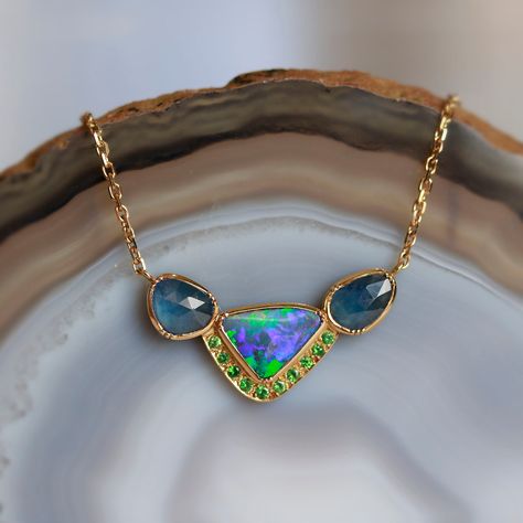 18k gold georgian bezel one of a kind boulder opal, blue sapphire and emerald necklace with 18k gold chain.  Fine jewellery hand made in London. Our 18k gold jewellery is hand forged by specialist jewellers using recycled gold, reflecting our love and respect for the process of quality craftsmanship and sustainability.  18k gold Carat weight opal 1.59ct, sapphire 1.82ct Pendant dimension 29.81mm x 11.77mm   Chain length 18" with adjustable loop at 16.5" (46-42cm) One of a kind item Torch Fired Enamel Jewelry, Stock Design, Alexis Bittar Jewelry, Boulder Opal Pendant, 18k Gold Chain, Alexandrite Ring, Fun Jewelry, Jewelry Hand, 18k Gold Jewelry