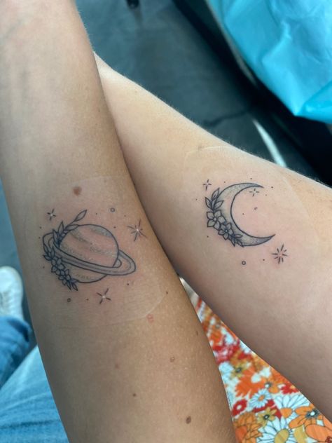 taylor swift moon and saturn tattoos from seven on folklore :) Seven Folklore Tattoo, Saturn Tattoo Aesthetic, Noon And Saturn Tattoo, Saturn Floral Tattoo, Saturn Flower Tattoo, Folklore Taylor Swift Inspired Tattoo, Floral Saturn Tattoo, Sun Moon Saturn Tattoo, Moon And Saturn Matching Tattoo