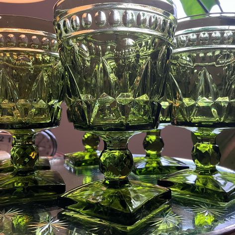 *** SOLD *** 1970s olive green glass goblets? Yes, please! These were introduced by Indiana Glass in 1957 and the pressed glass “Park Lane” pattern is just divine! They shimmer in the light and they’re quite the statement piece! ✨🫒💚🫒💚🫒✨ https://travelfarnowvintage.etsy.com/listing/1676621160 #olivegreen #vintagegreenglass #vintagegreenglassware #parklane #indianaglass #vintageindianaglass #elegantgreenglass Green Glass Dinnerware, Green Goblets, Green Vintage Glassware, Glass Goblets, Green Depressionware, Vintage Green Glass Overstock, Vintage Green Glass, Park Lane, Indiana Glass