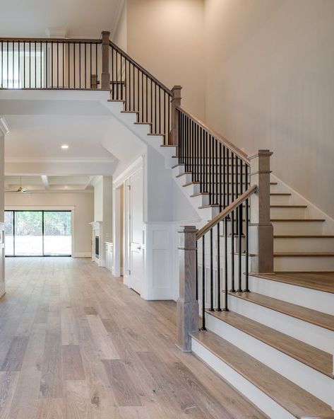 Homestead Building Company on Instagram: “Step back and admire the craftsmanship of this grand staircase! 🤩⁣ ⁣ Photo by @flyboyaerial ⁣ #homesteadbuilt #staircasedesign #staircase…” Large Open Staircase, Hotel Grand Staircase, Beautiful Staircases Grand Entrance, Big Staircase Grand Entrance, Double Staircase Entrance, Big Staircase, Stairway Entry, Grand Stairs, Farmhouse Stairs