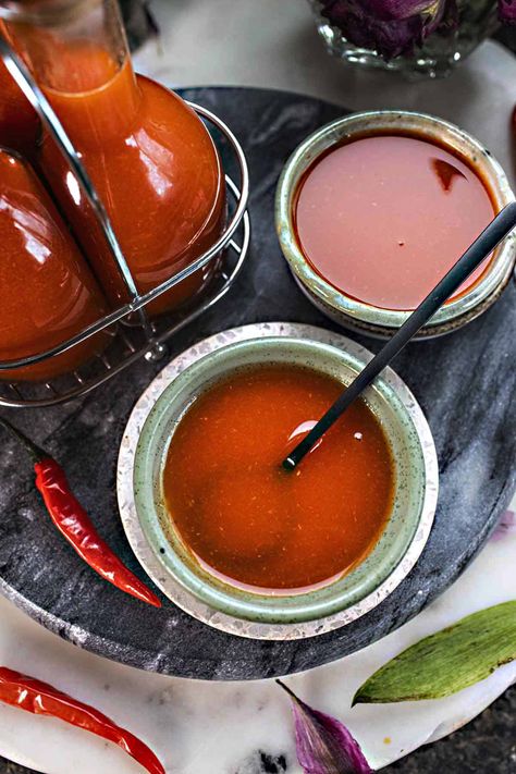 Spice up your taste buds with this easy Thai hot sauce recipe in this homemade Sriracha version. This sauce will bring heat to your dishes! Discover the authentic Thai Sriracha versus the American version and dive into a world of homemade goodness. The recipe only takes 20 minutes! #thaihotsauce #thaisriracha #thaihotsaucerecipes #sriracha #howtomakesriracha #homemadesriracha #thaihotsauces #homemadesrirachasauce #thaisauces Sriracha Sauce Recipe, Homemade Sriracha, Hot Sauce Recipe, Vegetarian Thai, Hot Sauce Recipes, Sriracha Sauce, Sriracha, Sauce Recipe, Sauce Recipes