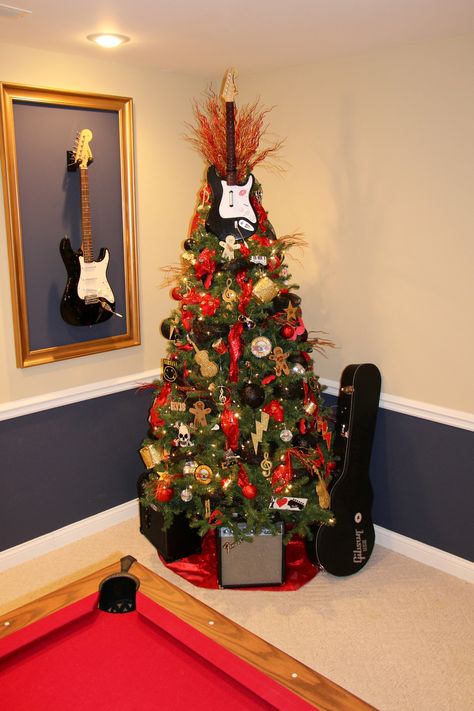 Rock N Roll Christmas Tree Tatted gingerbread man, Fender, guitar picks, Elvis, GnR, Nirvana, skulls. Rock N Roll Christmas, Roll Christmas Tree, Recycled Christmas Tree, Music Tree, Contemporary Christmas Trees, Christmas Tree Trimming, Pinterest Christmas, Frugal Christmas, Silver Christmas Decorations