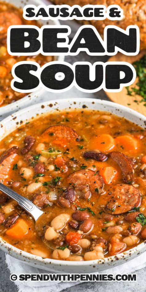 The sight of this bean soup with smoked sausage simmering on the stove is sure to make everyone hungry. With the help of Hambeen's 15-bean soup mix, this soup is sure to be packed full of color and flavor. With black beans, red and white kidney beans, yellow split peas, and more, this soup mix is the perfect addition to any soup. A recipe like this is perfect for when winter is knocking at the door! #beansoupwithsmokedsausage #beansoup #beansouprecipe #spendwithpennies Bean Chowder Recipe, 6 Bean Soup, Kalbasa Soup Recipe, Hamburger Bean Soup, 16 Bean Soup Recipe Stove Top, Polish Sausage Soup Recipes, Multi Bean Soup, Hillshire Sausage, Crockpot 15 Bean Soup