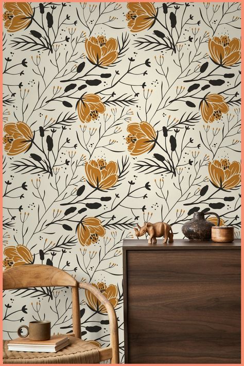 Floral wallpaper with mustard and black flowers behind a wooden cabinet and chair. Floral Boho Wallpaper, Thick Wallpaper, Wallpaper Peel, Wallpaper Home Decor, Boho Wallpaper, Commercial Wallpaper, Boho Beauty, Wallpaper Peel And Stick, Wallpaper Removable