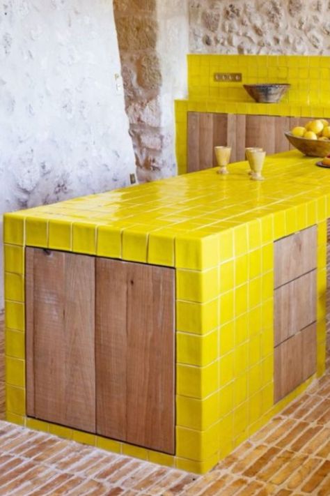 Acid Yellow glazed field tiles and special tiles featured in french kitchen island and kitchen backsplash. #newterracotta #glazedtiles #kitchendesign #yellow Yellow Tiled Kitchen, Tiled Kitchen Island, Yellow Tile Kitchen, Tile Kitchen Island, French Kitchen Island, Terracotta Kitchen Tiles, Mallorca House, Sealing Grout, New Terracotta