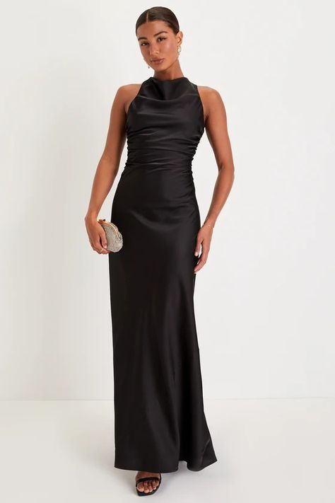 Everyone will be talking about how dreamy you look in the Lulus Effortlessly Sensational Black Satin Backless Maxi Dress! Sleek woven satin shapes this stunning dress with a high cowl neckline that continues into a draping, fitted bodice with gathering at the sides, all supported by wide straps that crisscross the otherwise open back. The figure-skimming slip silhouette falls effortlessly into an A-line skirt that ends at a sweeping maxi hem. Hidden back zipper/clasp. Black Maxi Wedding Guest Dress, Formal Guest Dresses For Wedding, Black Dress Black Tie Wedding, Floor Length Black Bridesmaid Dress, Black Satin Backless Dress, Black Silk Dress Bridesmaid, Fall Black Bridesmaid Dresses, Long Elegant Satin Dresses, Black Bridemaid Dress