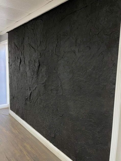 Modern Industrial Accent Wall, Concrete Wall Design Interior, Rock Wall Shower Ideas, Faux Rock Wall Interior Living Room, Textured Walls Black, Black Stucco Wall, Wood Panel Decor Ideas, Concrete Accent Wall Living Rooms, Accent Walls Basement