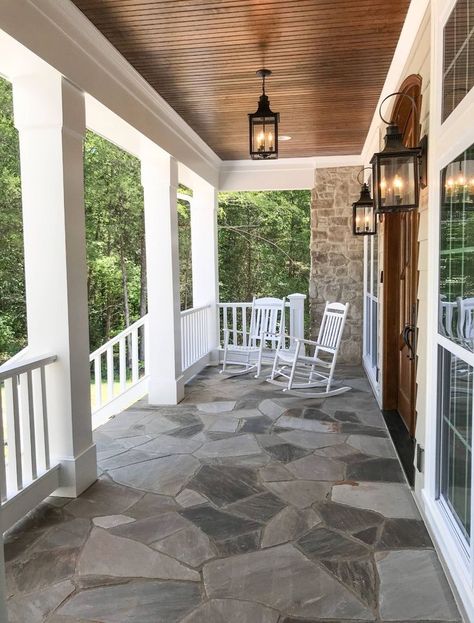 Love the flagstone and bead board on the ceiling. Wood Paneling Patio Ceiling, Wood Panel Porch Ceiling, Wood Under Front Porch Ceiling, Front Porch With Barrel Ceiling, Stained Beadboard Ceiling Porch, Beadboard Outdoor Ceiling, Back Patio Ceiling Ideas, Headboard Porch Ceiling, Porch Ceiling Beadboard