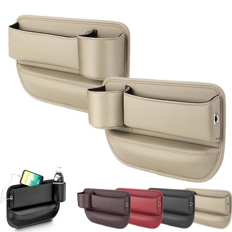 PRICES MAY VARY. Cup Holder Gap Bag: Cup holder gap bag seamlessly fills the space between your car seats, providing convenient storage for essentials like cell phones, keys, cards, and sunglasses. Car Leather Cup Holder Gap Bag: Featuring cup holders, our organizer makes accessing beverages easy. The reserved holes on the sides allow phone charging cables to pass through, catering to different car models' needs. Premium Material: Car leather cup holder gap bag is made of durable ABS plastic and Leather Cup Holder, Car Seat Gap Filler, Seat Gap Filler, Gap Bag, Leather Car Seats, Seat Storage, Box Car, Car Storage, Cars Organization