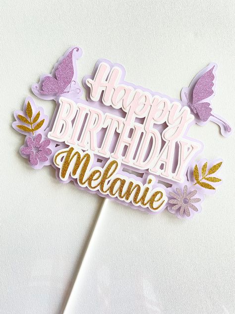 This custom happy birthday name cake topper is sure to impress your guests on your special day. Click to shop now!  Designed with the utmost detail specially made for you! Perfect to use to decorate cake, place in flower bouquet/fruit basket, or as a photo prop. You might also like this: https://www.etsy.com/ca/listing/1196892459/custom-name-cake-topper-birthday-cake?ref=shop_home_active_5&sca=1  Our cake toppers are created with 65lb high quality premium acid -free cardstocks & a food safe stick. Cake Toppers are cut with a professional cutting machine to ensure seamless clean edges. CUSTOMIZATION: This topper can be customized to fit your theme. > Name > Color > Image (If you'd like to replace the butterflies/flowers/leaves or remove entirely please let us know!) PRODUCTION TIME: 1-3 bus Butterflies Cake Topper, Cricut Cake Topper, Cake Topper Flowers, Cake Topper Ideas, Personalized Cake Topper Birthday, Happy Birthday Logo, Happy Birthday Topper, Pink Cake Toppers, Cake Toppers Birthday