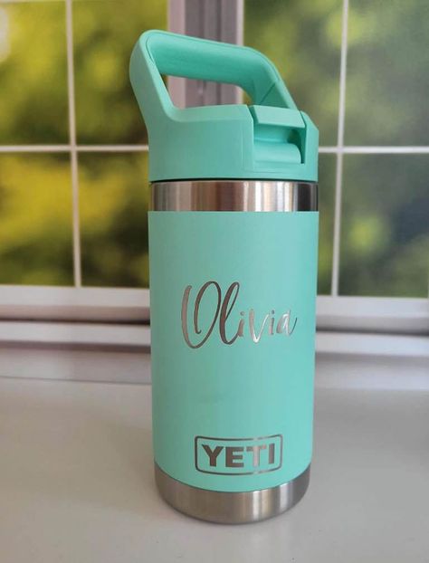 Personalized Engraved YETI 12oz Rambler Junior Water Bottle | Kids YETI Cup | Kids Water Bottle | Sports Youth | Children Water Bottle These super cute water bottles are perfect for the fun-loving kids in your life.  These are genuine YETI 12oz Rambler Junior water bottles.  The name is engraved and will never fade or wash away.  If there's something different you would like engraved on the cup, just let me know!    This product is made to order so the design may slightly differ on each item. PR Engraved Yeti Tumbler, Toddler Water Bottle, Personalized Water Bottles Kids, Yeti Rambler Tumblers, Engraved Yeti, Powder Coated Tumblers, Cute Water Bottles, Yeti Tumbler, Yeti Cup