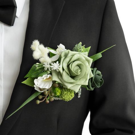 PRICES MAY VARY. Design Inspiration: Immerse yourself in a green wonderland with Ling’s Emerald and Tawny Beige collection. Size: The pocket square boutonniere is approx. 6" W x 5" H. Combination of flower and card, the groom can easily put the boutonniere into suit jacket pockets. Material: The boutonnieres are made of real-looking artificial flowers and greenery, dotted with some exquisite accessories. Great Design: A Deluxe boutonnieres designed for the groom. The unique design is convenient Artificial Flowers For Wedding, Green Boutonniere, Pocket Boutonniere, Boutonnieres Prom, White Boutonniere, Western Themed Wedding, Wedding Color Pallet, Groomsmen Boutonniere, Rose Boutonniere