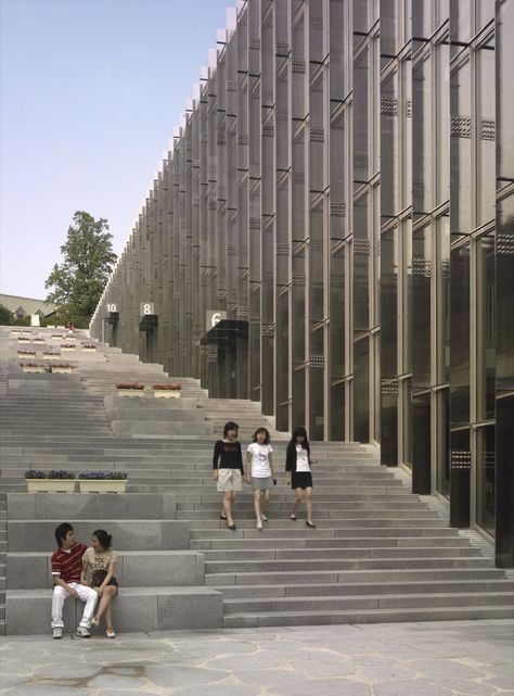 Ewha Campus Complex, an underground building at EWHA Womans University in Seoul, South Korea, was designed with a "canyon" stairway/walkway area through its middle.  Entries to the building are located at different levels along the stairs/walkway.   - photo by André Morin   ...Lots and lots of stairs!... Ewha Womans University, Underground Building, Stair Design Architecture, Landscape Stairs, Building Stairs, Public Space Design, Exterior Stairs, Stairs Architecture, Banda Aceh