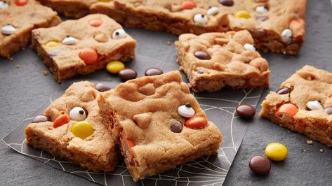 Delight little ghost and goblins with this easy peanut butter cookie bar. Halloween Cookie Bars, Betty Crocker Peanut Butter Cookies, Reese's Cookies, Peanut Butter Cookie Bars, Ghosts And Goblins, Reese's Pieces, Candy Eyeballs, Easy Peanut Butter Cookies, Hallowen Ideas