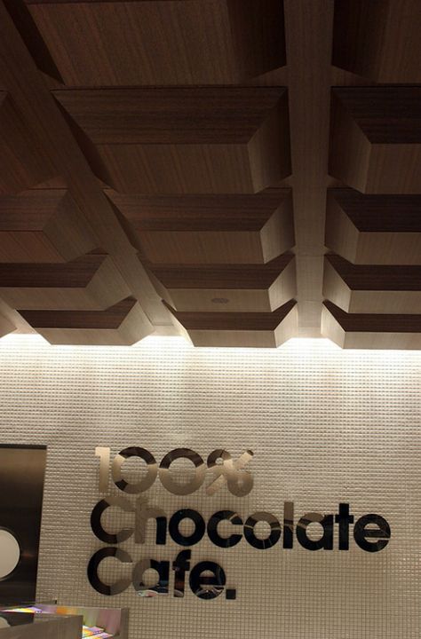 100% chocolate cafe is run by old Japanese chocolate brand, Meiji. The environment was designed by Masamichi Katayama of Wonderwall, while all the graphics were by Groovisions. Chocolate Store Design, Meiji Chocolate, Chocolate Boutique, Japanese Chocolate, Bakery Interior, Chocolate Stores, 카페 인테리어 디자인, Chocolate Design, Chocolate Brands