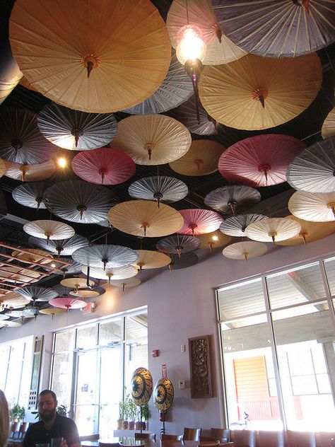 Parasols are such a fun way to decorate for any wedding or event! Find them for rent and /or sale at splendorforyourguests.com!  Splendor for Your Guests | Rental Company | Weddings | Events | Shawls | Blankets | Umbrellas | Parasols | Fans Paper Parasol, Japanese Umbrella, Umbrella Decorations, Paper Umbrellas, Umbrellas Parasols, Ceiling Decor, The Ceiling, Restaurant Interior, Ceiling Design