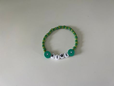 "Harry Styles Kiwi Inspired Friendship Bracelet! String is stretchy but it is recommended to get your wrist size. Made to be about 7 inches but can be adjusted if smaller or larger size is needed! Comment in the \"add your personalization\" box if different size is needed." Kiwi Bracelet, Friendship Bracelet String, Bracelet String, Seal Beach, Bracelet Ideas, Friendship Bracelet, Kiwi, Friendship Bracelets, Harry Styles