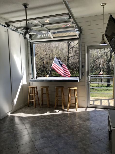 The full view garage door opening up on the bar looking towards the Niangua River. Small Garage Door, Roll Up Garage Door, Garage Windows, Garage Door Windows, Backyard Garage, Garage Door Styles, Window Bars, Bar Shed, Glass Garage Door