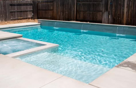 Small Pool With Tanning Ledge And Hot Tub, In Ground Pool With Tanning Ledge, Pool With Sun Shelf And Spa, Liner Pool With Hot Tub, Geometric Pool Designs With Spa And Tanning Ledge, Pool Landing Ideas, Simple Pool Water Feature, Gunite Pool Tile Ideas, Gunite Pool Ideas With Tanning Ledge