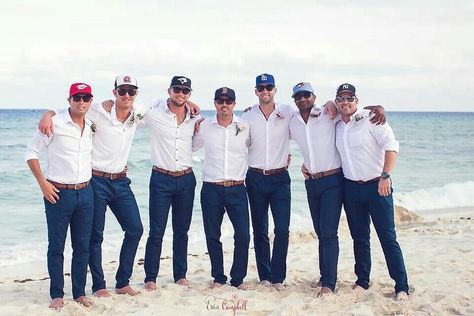 Groomsmen Blue Pants, Groom With Baseball Hat, Groom Baseball Hat Weddings, Casual Groom Attire Beach, Destination Wedding Groom Attire, Groomsmen Shorts, Beach Wedding Groom Attire Blue, Simple Groomsmen Attire, Beach Wedding Bridal Party Attire