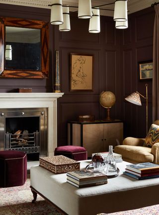 Dark Burgundy Walls, Chocolate Brown Living Room Ideas, Moody Living Room Paint Colors, Burgundy Living Room Ideas, Purple Walls Living Room, Moody Den, Living Room With Color, Living Room Paint Ideas, Living Room Color Ideas